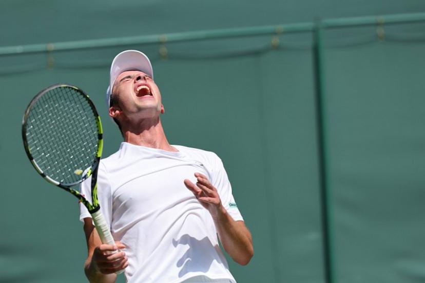 Britain's Oliver Tarvet reacts as he plays against Switzerland's Leandro Riedi during their men's singles first round tennis match on the first day of the 2025 Wimbledon Championships at The All England Lawn Tennis and Croquet Club in Wimbledon, southwest London, on June 30, 2025.  Adrian Dennis / AFP