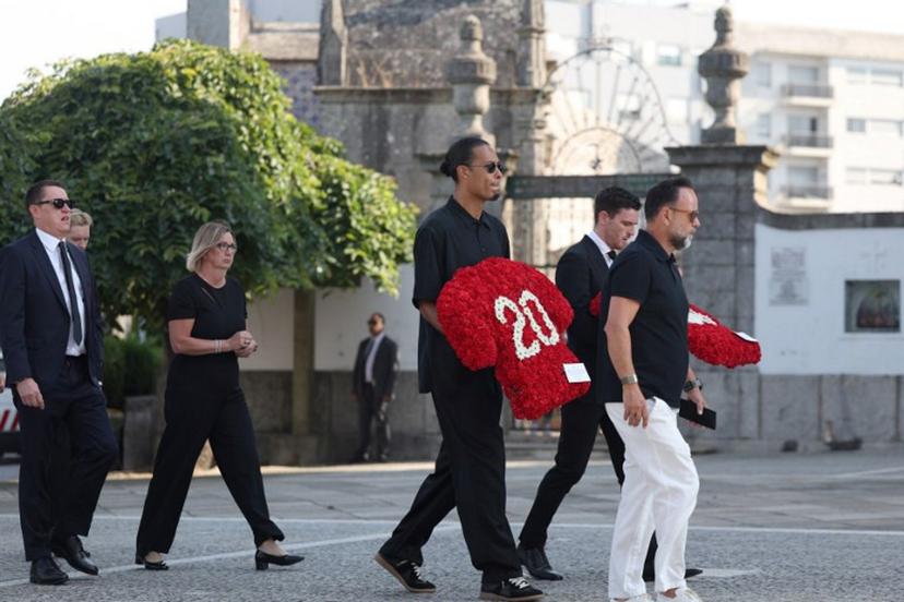 Liverpool's Dutch defender Virgil van Dijk (C) and Liverpool's Scottish defender Andy Robertson (2R) arrive for the funerals of Liverpool's Portuguese forward Diogo Jota and his brother Andre Silva at the Mother Church of Gondomar, on the outskirts of Porto, on July 5, 2025. Liverpool forward Diogo Jota and his brother died in a car crash in Spain on July 3, 2025, sparking widespread grief just after the Portugal star had got married. FILIPE AMORIM / AFP