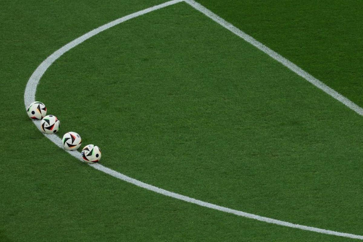Match balls are set up for warm ups ahead of the UEFA Euro 2024 Group E football match between Ukraine and Belgium at the Stuttgart Arena in Stuttgart on June 26, 2024.  LLUIS GENE / AFP