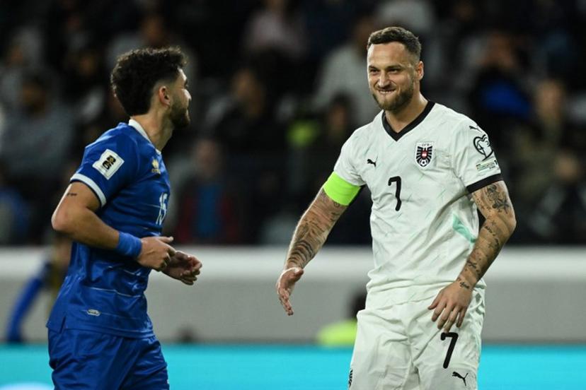 Austria's forward #07 Marko Arnautovic (R) reacts after scoring his team's first goal from the penalty spot during the FIFA World Cup 2026 European qualification football match between Cyprus and Austria at the Alphamega Stadium, on the outskirts of Limassol, on November 15, 2025.  Jewel SAMAD / AFP