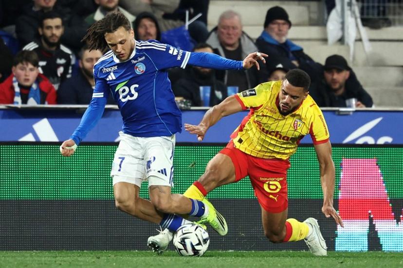 Lens' French defender #14 Matthieu Udol (R) fights for the ball with Strasbourg's Belgian midfielder #07 Diego Moreira during the French L1 football match between RC Strasbourg Alsace and Lens (RCL) at the Stade de la Meinau in Strasbourg, eastern France, on February 27, 2026.   Frederick FLORIN / AFP