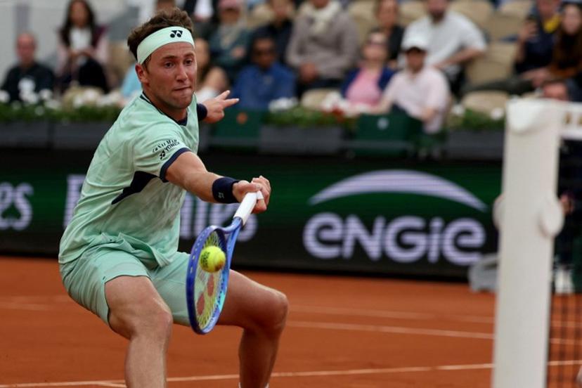 Norway's Casper Ruud plays a forehand return to Portugal's Nuno Borges during their men's singles match on day 4 of the French Open tennis tournament on Court Suzanne-Lenglen at the Roland-Garros Complex in Paris on May 28, 2025.  ALAIN JOCARD / AFP