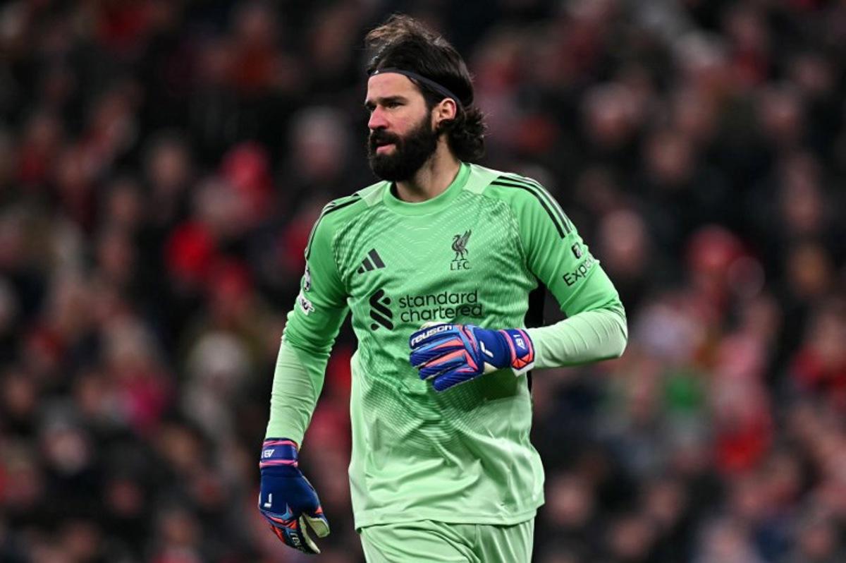 Liverpool's Brazilian goalkeeper #01 Alisson Becker looks on during the UEFA Champions League football match between Liverpool and Qarabag at Anfield in Liverpool, north west England on January 28, 2026.  Paul ELLIS / AFP