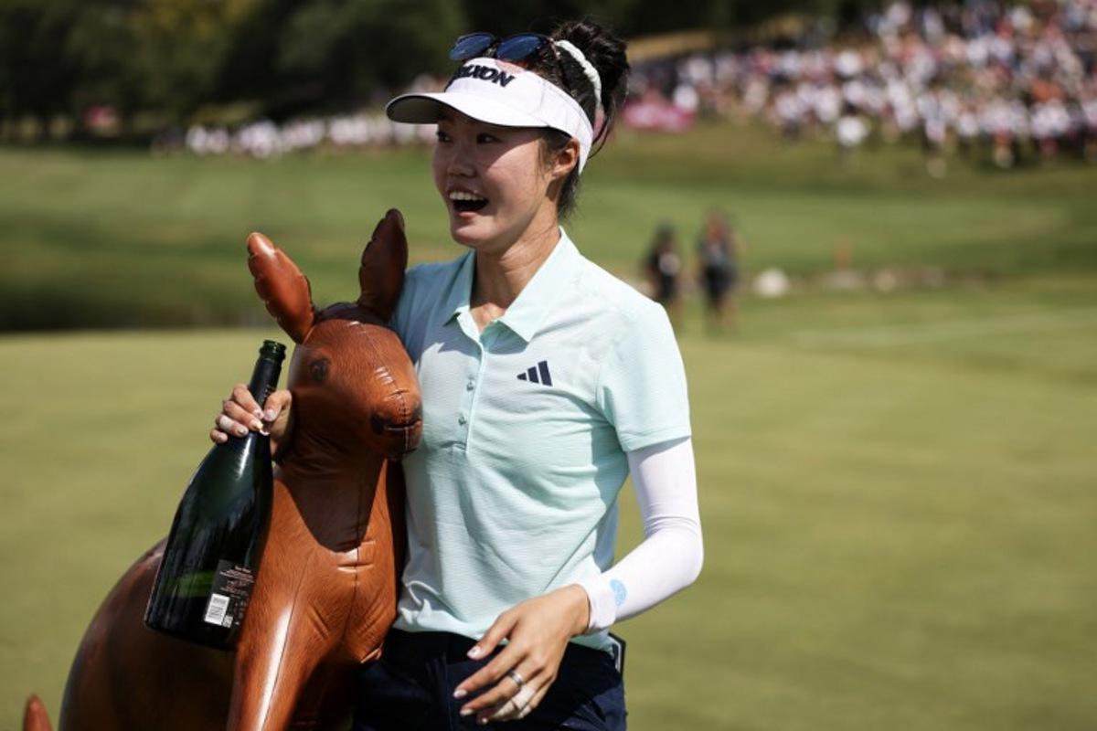 Australia's Grace Kim celebrates after victory on the first playoff hole after the final round of the Amundi Evian Championship at Evian Resort Golf Club, in Evian-Les-Bains, eastern France on July 13, 2025.  Alex MARTIN / AFP