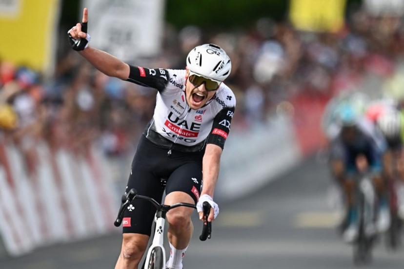 UCI WorldTeam UAE Team Emirates XRG's Australian rider Jay Vine celebrates after crossing the finish line to win the third stage of the Tour of Romandie UCI cycling World tour, 183.1 km loop from the start to the finish in Cossonay, near Vullierens, on May 2, 2025.  Fabrice COFFRINI / AFP