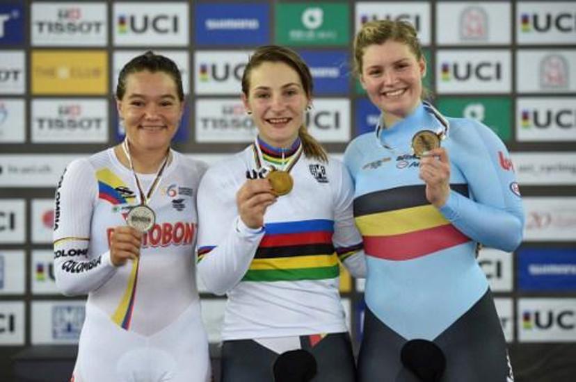 Gold medallist Kristina Vogel of Germany poses with silver medallist Martha Bayona Pineda of Colombia (L) and bronze medallist Nicky Degrendele of Belgium (R) on the podium after the women's keirin final at the Hong Kong Velodrome during the Track Cycling World Championships in Hong Kong on April 16, 2017.  Jayne RUSSELL / AFP