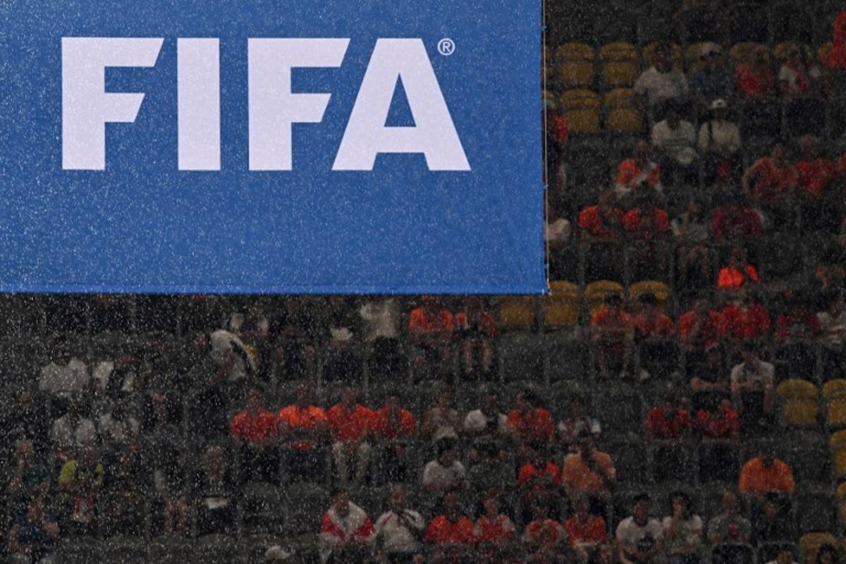 Rain falls in front of a FIFA logo before the start of the UEFA Euro 2024 semi-final football match between the Netherlands and England at the BVB Stadion in Dortmund on July 10, 2024.  Kirill KUDRYAVTSEV / AFP
