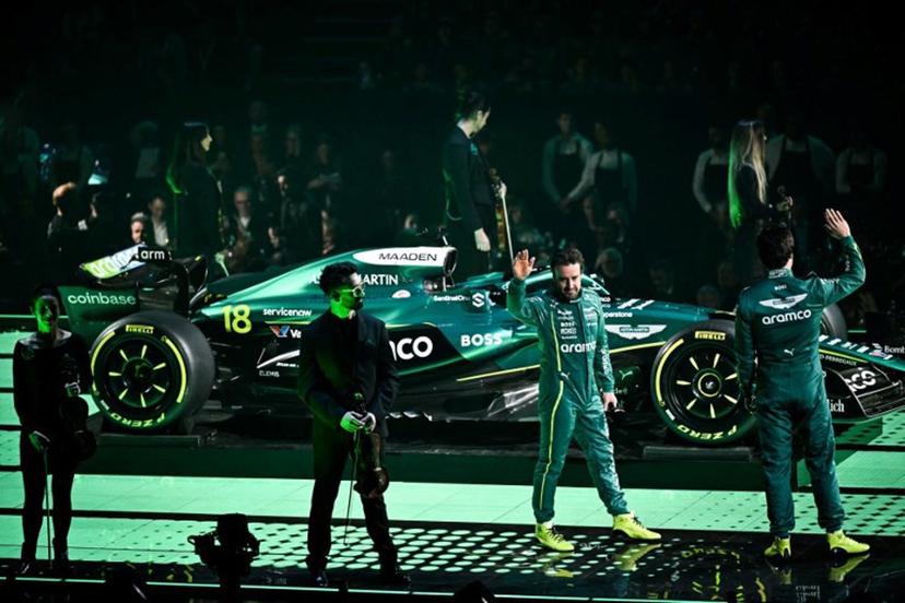 Aston Martin's Spanish driver Fernando Alonso  (2nd R) and Aston Martin's Canadian driver Lance Stroll (R) stand by the new Formula 1 car of Aston Martin Formula One Team during the Formula One - 2025 season launch "F1 75 LIVE" event at the O2, in London, on February 18, 2025  Ben STANSALL / AFP