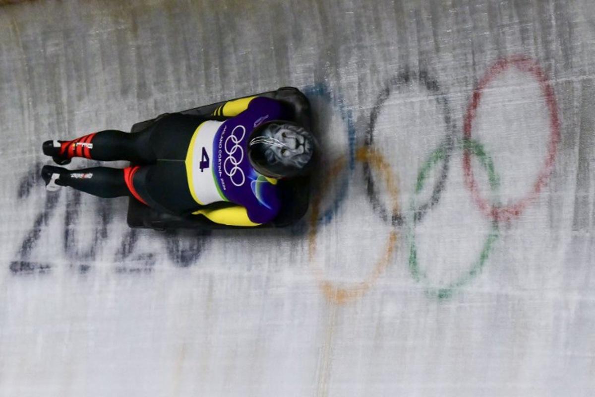 Belgium's Kim Meylemans competes in the skeleton women's heat 2 at Cortina Sliding Centre during the Milano Cortina 2026 Winter Olympic Games in Cortina d'Ampezzo on February 13, 2026.  Stefano RELLANDINI / AFP