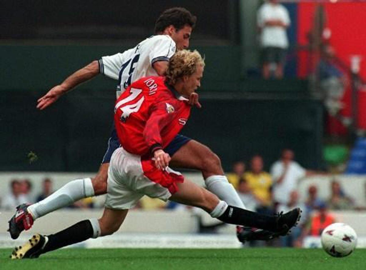 Manchester United's Jordi Cruyff (Front) and Tottenham Hotspur's Ramon Vega fight for the ball during the match at White Hart Lane in London 10 August. Manchester United won the game 2-0 which puts them top of the Premier league after the first weekend of the soccer season.
