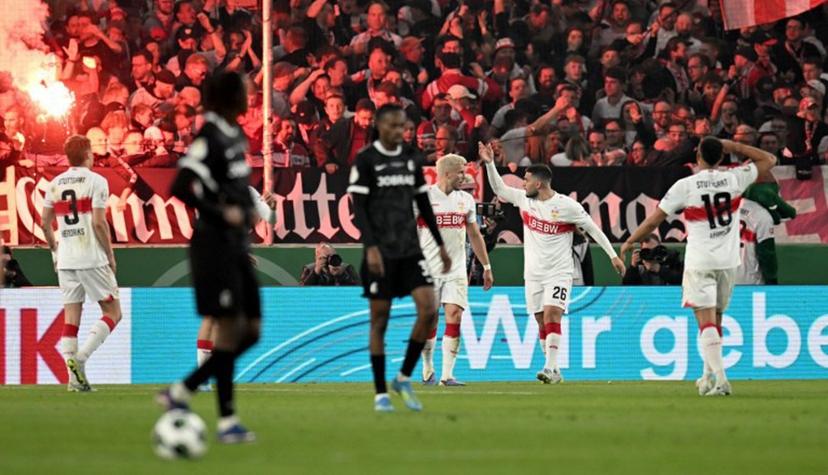 Stuttgart's German forward #26 Deniz Undav (2nd R) celebrates with teammates after scoring the 1-1 goal during the German Cup (DFB-Pokal) semi-final football match between VfB Stuttgart and FC Freiburg in Stuttgart, southwestern Germany, on April 23, 2026.  THOMAS KIENZLE / AFP