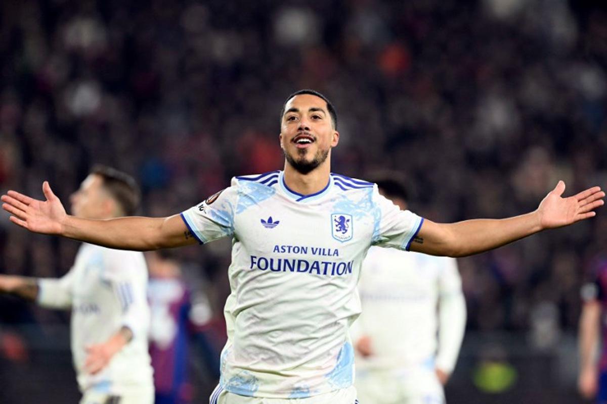 Aston Villa's Belgian midfielder #08 Youri Tielemans celebrates his team's second goal during the UEFA Europa League, league phase, football match between FC Basel and Aston Villa at the St Jakob-Park satdium, in Basel, on December 11, 2025.  SEBASTIEN BOZON / AFP