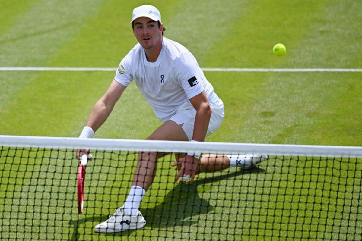 Brazil's Joao Fonseca returns to Russia's Roman Safiullin during their men's singles third round tennis match on the fifth day of the 2026 Wimbledon Championships at The All England Lawn Tennis and Croquet Club in Wimbledon, southwest London, on July 3, 2026.  Kirill KUDRYAVTSEV / AFP