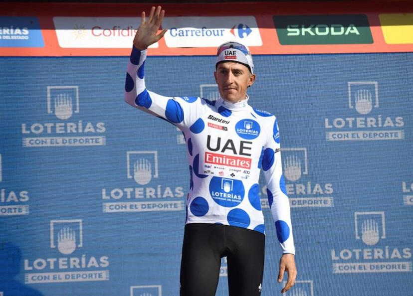 Team UAE's Marc Soler wearing the climber ranking leader celebrates on the podium after the stage 19 of the Vuelta a Espana, a 173,5 km race between Logrono and Alto de Moncalvillo, on September 6, 2024.    ANDER GILLENEA / AFP