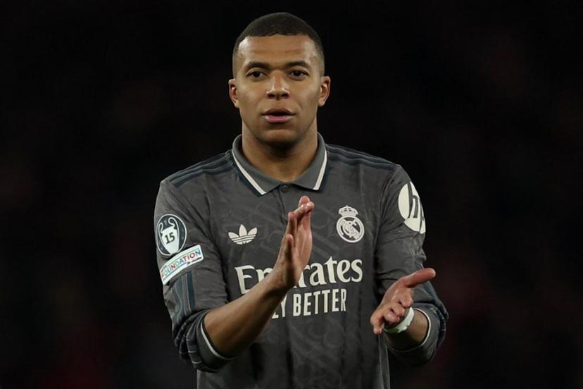 Real Madrid's French forward #09 Kylian Mbappe applauds the fans following the UEFA Champions League Quarter final first leg football match between Arsenal and Real Madrid, at the Emirates Stadium, in London, on April 8, 2025.   Adrian Dennis / AFP