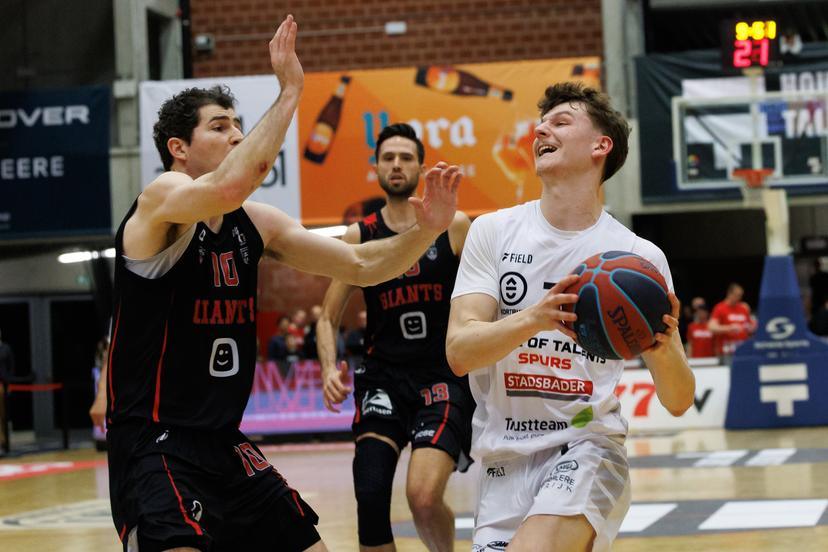 Antwerp's Andrew Funk and Kortrijk's Jules Isebaert fight for the ball during a basketball match between House of Talents Spurs Kortrijk and Antwerp Giants, Friday 16 January 2026 in Kortrijk, on day 16 (out of 34) of the 'BNXT League' first division basket championship. BELGA PHOTO KURT DESPLENTER