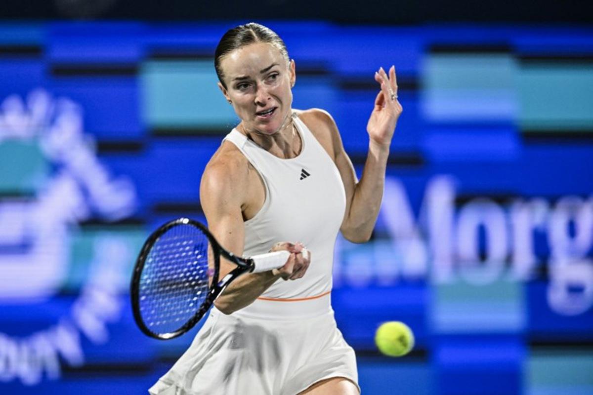 Ukraine's Elina Svitolina hits a return to US' Jessica Pegula during their women's singles final match at the Dubai Duty Free Tennis tournament in Dubai on February 21, 2026.  Ryan Lim / AFP