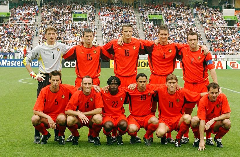 BRU04 - 20020614 - SHIZUOKA, JAPAN : Belgian team poses for a picture at the beginning of the Group H first round last match Belgium-Russia of the 2002 FIFA World Cup in Korea and Japan, 14 June 2002 at Shizuoka Stadium. Belgium defeated Russia 3-2 and qualified for the second round. (L-R, Up) Geert De Vlieger, Jacky Peeters, Daniel Van Buyten, Glen De Boeck, Marc Wilmots. (L-R, down) Nico Van Kerckhoven, Yves Vanderhaeghe, Mbo Mpenza, Johan Walem, Gert Verheyen, Bart Goor.  BELGA PHOTO YVES BOUCAU