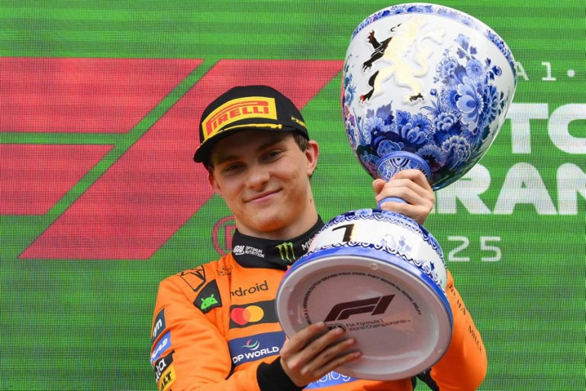Winner McLaren's Australian driver Oscar Piastri celebrates on the podium following the Formula One Dutch Grand Prix at The Circuit Zandvoort, western Netherlands, on August 31, 2025.  JOHN THYS / AFP