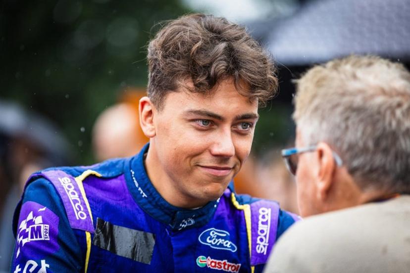 Latvian driver Martins Sesks (L) gives an interview during the regroup section at the WRC Rally Finland in Jyvaskyla, Finland on August 2, 2025.  Valtteri Vainio / Lehtikuva / AFP