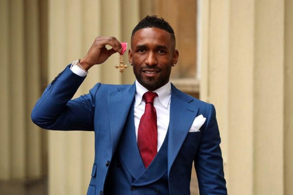 England and Bournemouth footballer Jermain Defoe poses with his medal after he was appointed Officer of the Order of the British Empire (OBE) at an investiture ceremony at Buckingham Palace, London on November 16, 2018, for services to the Jermain Defoe Foundation.     Jonathan Brady / POOL / AFP