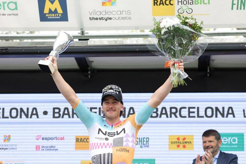 Team NSN Cycling Team's Australian rider Brady Gilmore celebrates on the podium winning the seventh and last stage of the 2026 'Volta a Catalunya' cycling tour of Catalonia, a 95,1 km race between Barcelona and Barcelona, on March 29, 2026.  Josep LAGO / AFP