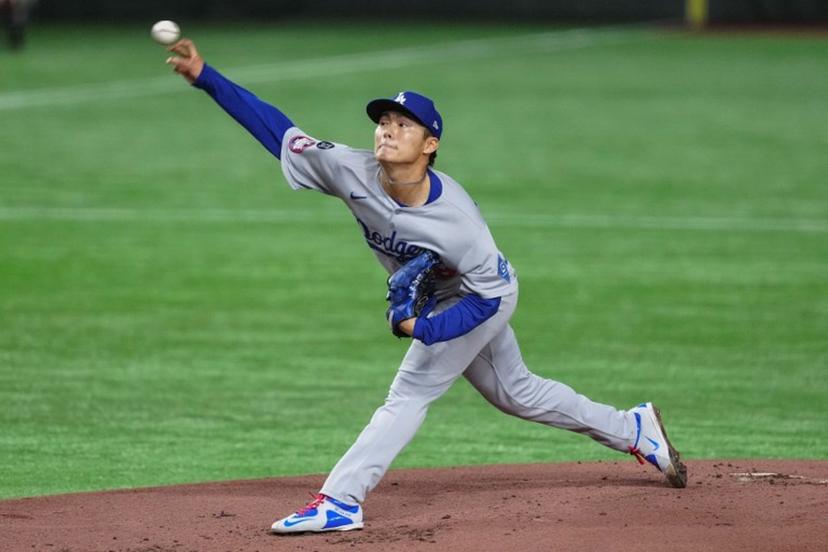 Los Angeles's Yoshinobu Yamamoto pitches in the first inning during the baseball game between Los Angeles Dodgers and Chicago Cubs in the MLB Tokyo Series outside of the Tokyo Dome in Tokyo on March 18, 2025.  Yuichi YAMAZAKI / AFP