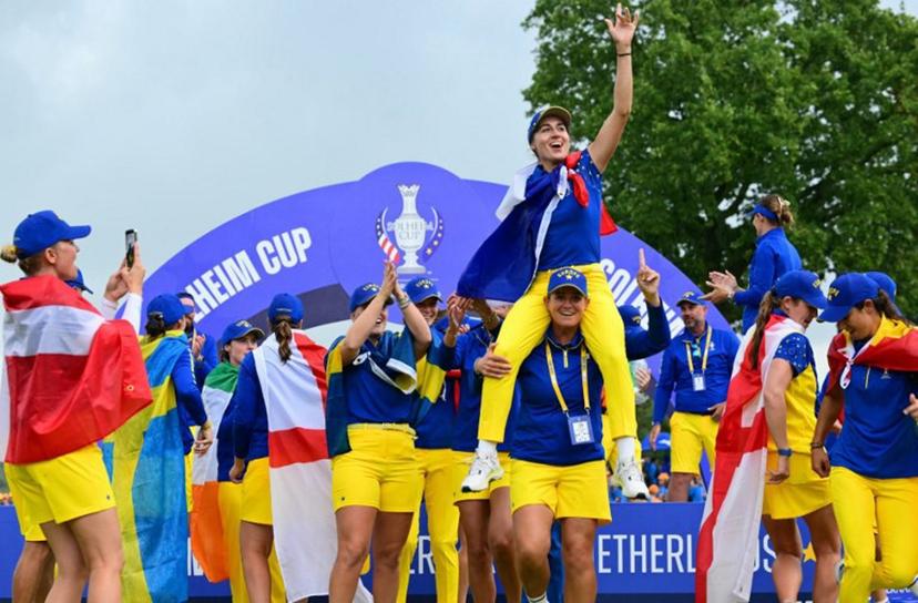 Team Europe's players including French golfer Nastasia Nadaud (C) celebrate with the trophy after victory on the final day of the 2026 Solheim Cup biennial team golf competition on The Bernardus Golf Course at Cromvoirt, some 80kms south-east of Rotterdam on September 13, 2026.   NICOLAS TUCAT / AFP
