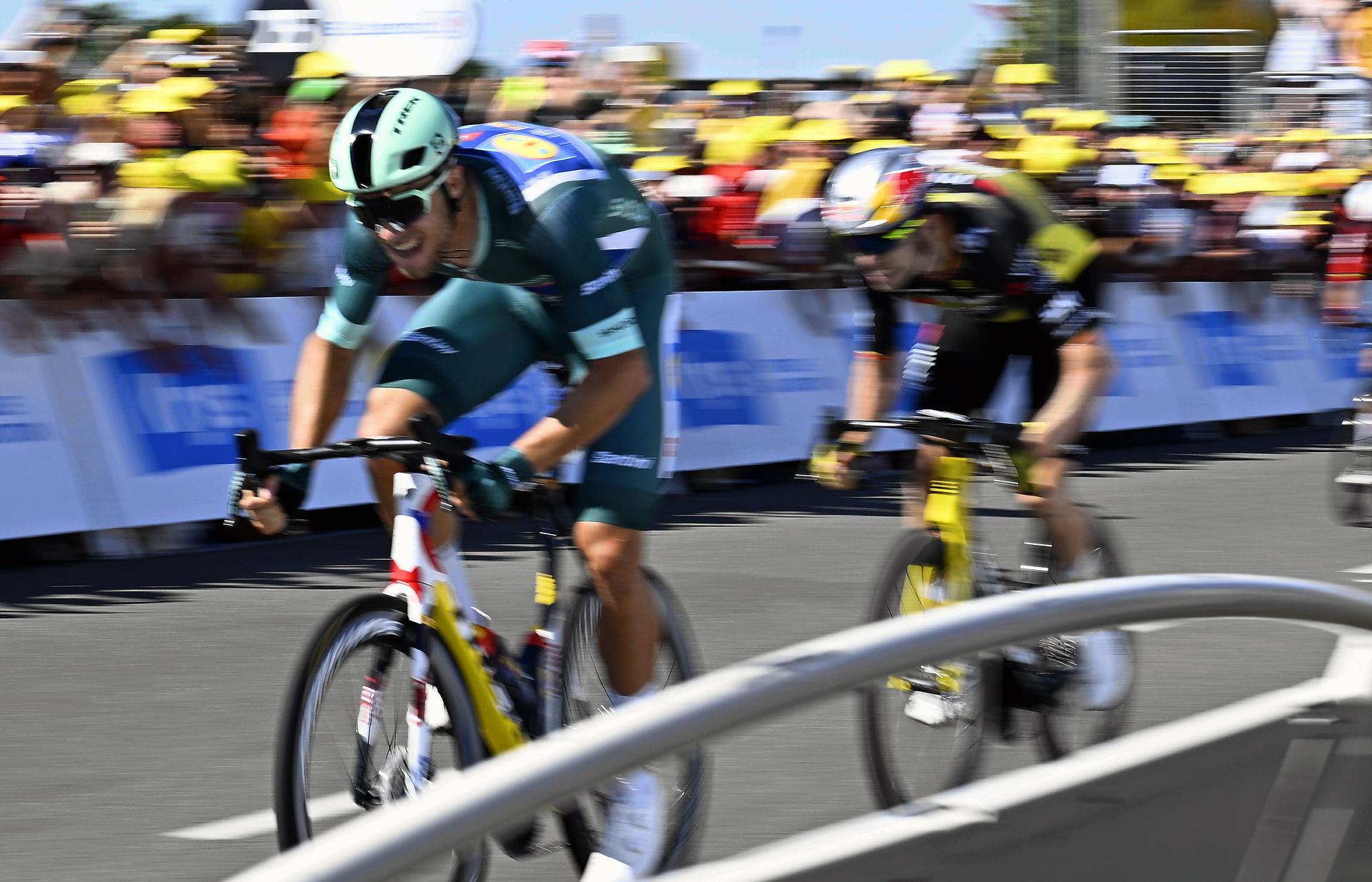 Italian Jonathan Milan of Lidl-Trek and Belgian Wout van Aert of Team Visma-Lease a Bike sprint to the finish of stage eight of the 2025 Tour de France cycling, from Saint-Meen-le-Grand to Laval Espace Mayenne (174 km), on Saturday 12 July 2025 in France. The 112th edition of the Tour de France starts on Saturday 5 July in Lille, France, and will finish in Paris, France on the 27th of July. BELGA PHOTO JASPER JACOBS