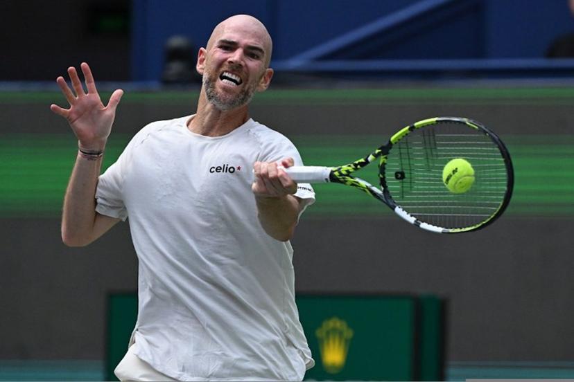 France's Adrian Mannarino hits a return to Italy's Matteo Berrettini during their men's singles match at the Shanghai Masters tennis tournament in Shanghai on October 1, 2025.  Jade Gao / AFP