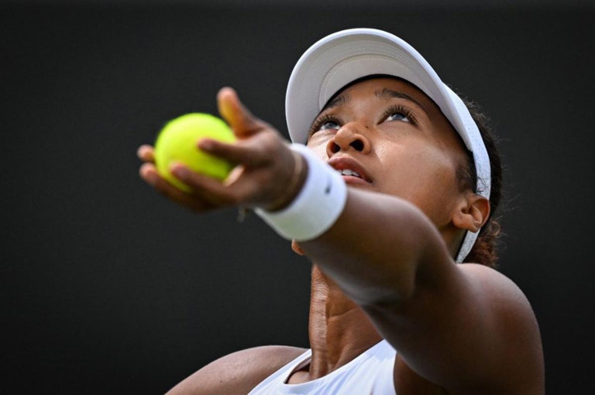 Japan's Naomi Osaka serves to Russia's Anastasia Pavlyuchenkova during their women's singles third round tennis match on the fifth day of the 2025 Wimbledon Championships at The All England Lawn Tennis and Croquet Club in Wimbledon, southwest London, on July 4, 2025.  Kirill KUDRYAVTSEV / AFP