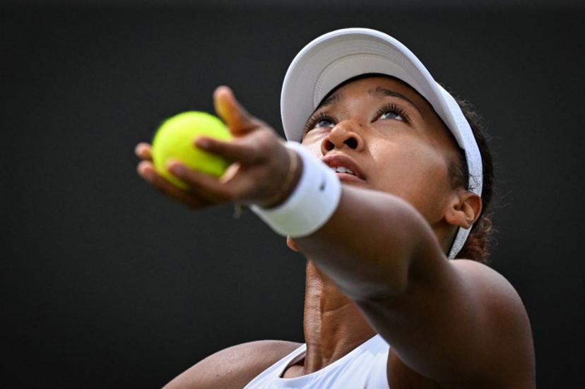 Japan's Naomi Osaka serves to Russia's Anastasia Pavlyuchenkova during their women's singles third round tennis match on the fifth day of the 2025 Wimbledon Championships at The All England Lawn Tennis and Croquet Club in Wimbledon, southwest London, on July 4, 2025.  Kirill KUDRYAVTSEV / AFP