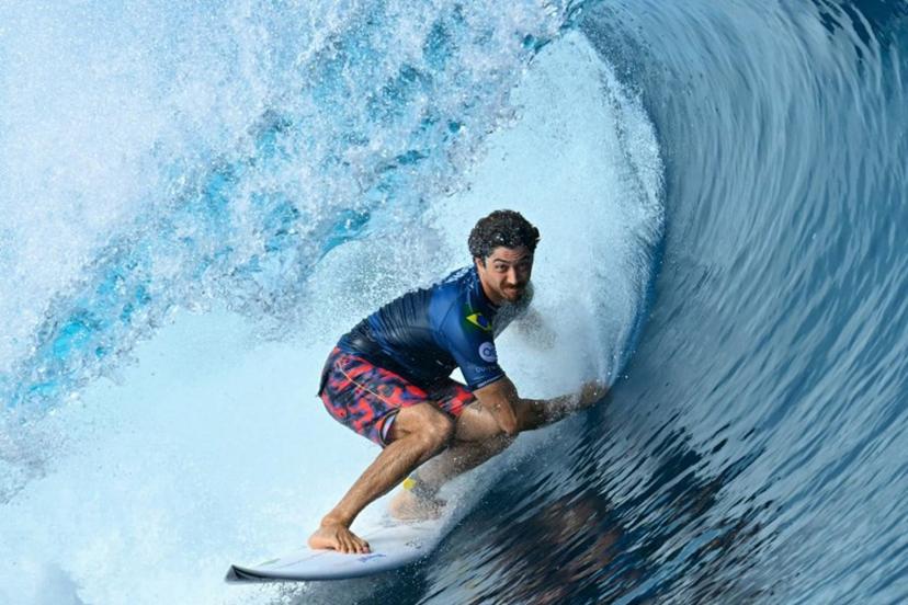 Brazilian surfer Yago Dora competes in the men's round of 16 of the Shiseido Tahiti Pro surfing competition against South African surfer Jordy Smith, in Teahupo'o, on the French Polynesian Island of Tahiti, on May 30, 2024. Teahupo'o will host the surfing event of the Paris 2024 Olympic Games. JEROME BROUILLET / AFP
