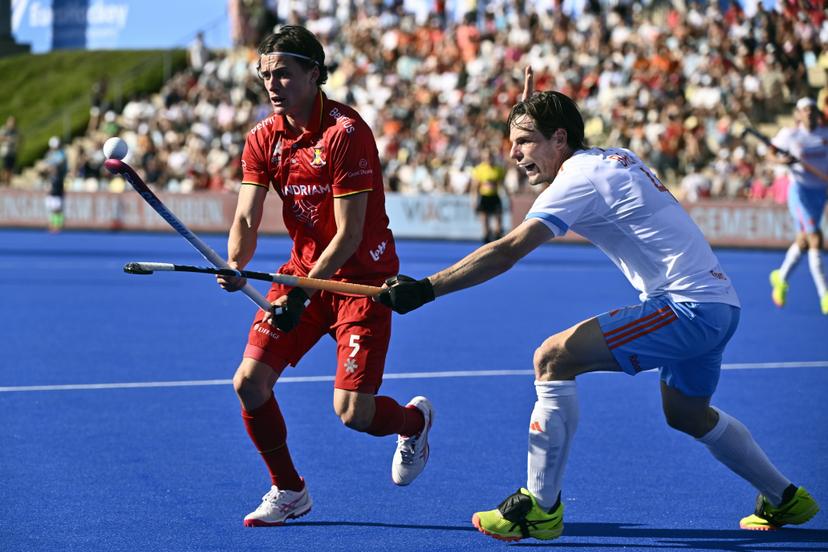 Belgium's Arno Van Dessel and Dutch Lars Balk pictured in action during a hockey game between Belgian national team Red Lions and The Netherlands, match 2/3 in the pool stage of the 2025 men's European championships, Sunday 10 August 2025 in Monchengladbach, Germany. BELGA PHOTO ERIC LALMAND