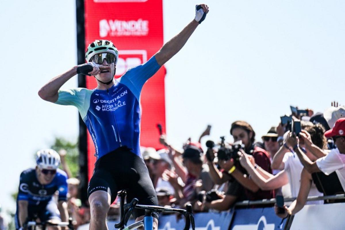 Decathlon-AG2R La Mondiale's French rider Dorian Godon gestures as he crosses the finish line to win the men's Elite race of the French National Road Cycling championships, in Les Herbiers, western France, on June 29, 2025.  Sebastien Salom-Gomis / AFP