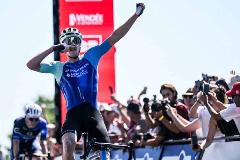 Decathlon-AG2R La Mondiale's French rider Dorian Godon gestures as he crosses the finish line to win the men's Elite race of the French National Road Cycling championships, in Les Herbiers, western France, on June 29, 2025.  Sebastien Salom-Gomis / AFP