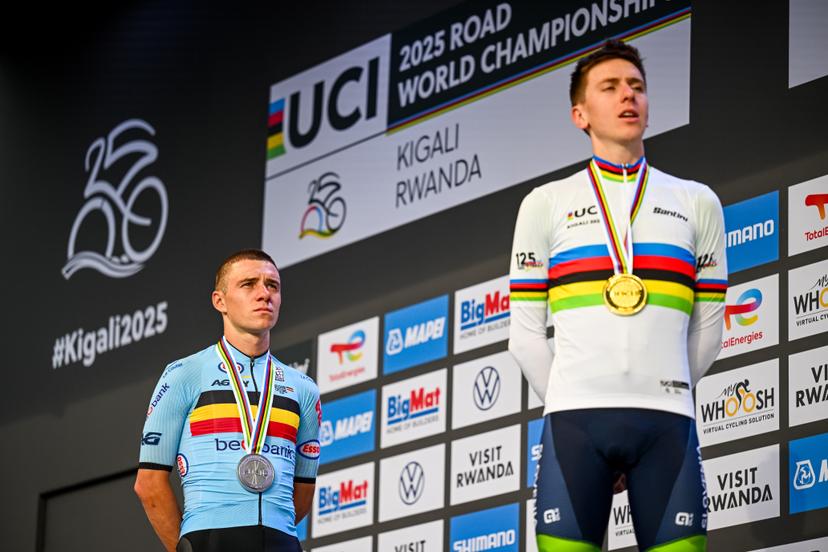 Belgian Remco Evenepoel and Slovenian Tadej Pogacar pictured on the podium after the elite men road race (267,5 km) at the cycling road World Championships in Kigali, Rwanda, Sunday 28 September 2025. The 2025 UCI Road World Championships take place from 21 to 28 September in Kigali, Rwanda. BELGA PHOTO DIRK WAEM
