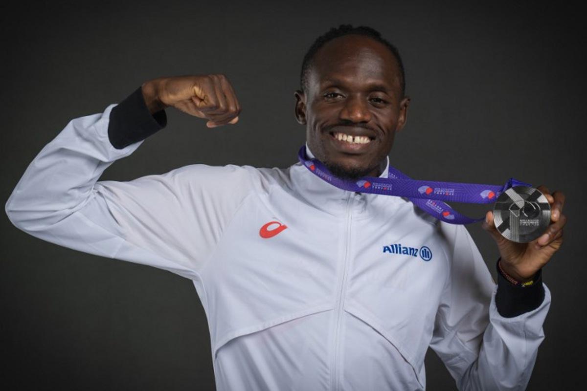 Silver medallist in the men's 5000m event Belgium's athlete Isaac Kimeli poses for portraits during a studio photo session on the sidelines of the World Athletics Championships in Tokyo on September 21, 2025.  Andrej ISAKOVIC / AFP
