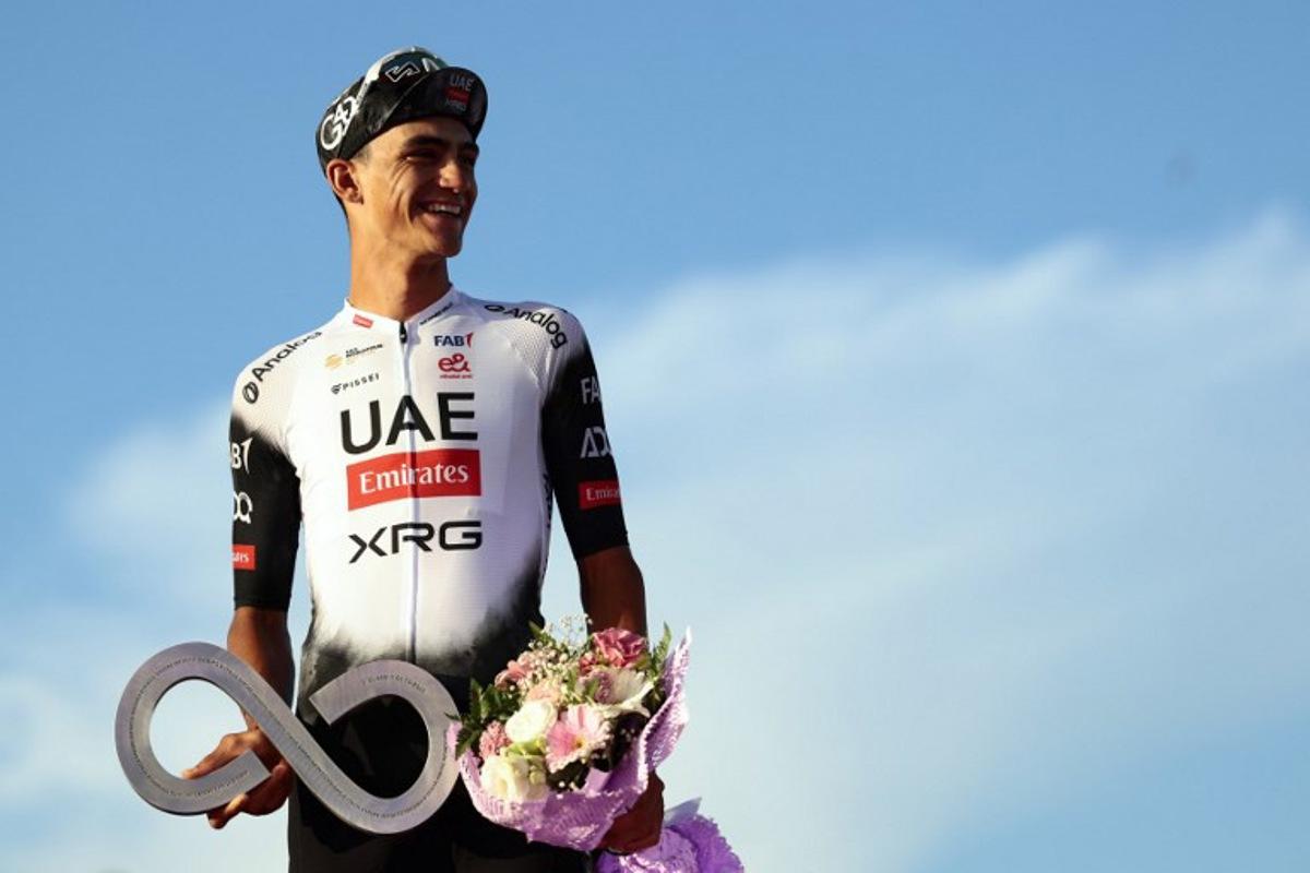 Second placed UAE Team Emirates XRG's Mexican rider Isaac Del Toro celebrates on the podium at the end of the 21st and last stage of the 108th Giro d'Italia cycling race of 143kms from Rome to Rome on June 1, 2025.  Luca Bettini / AFP