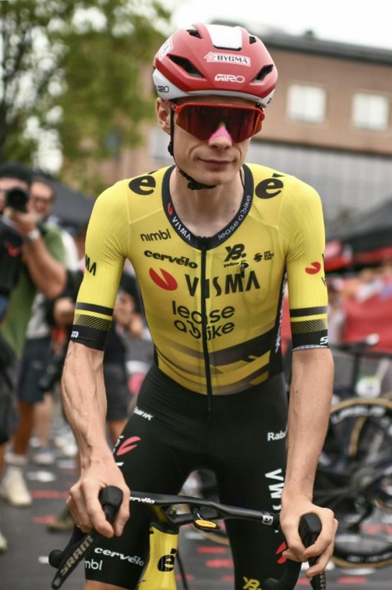 Team Visma-Lease a bike's Danish rider Jonas Vingegaard arrives to compete in the second stage of the Vuelta a Espana, a 159,6 km race between Alba and Limone Piemonte, in Italy's Piemonte region, on August 24, 2025.    Marco BERTORELLO / AFP