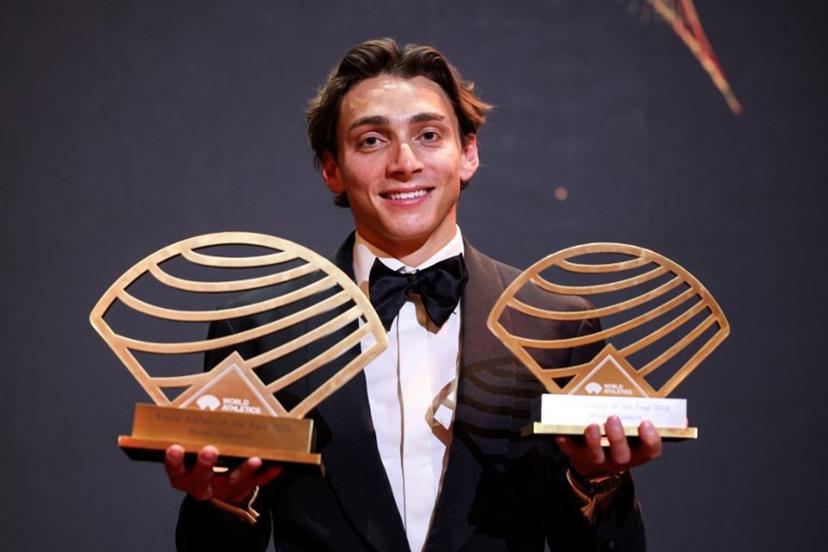 Sweden's world pole vault champion Armand Duplantis poses with the Men's World athlete of the year award and Men's field athlete of the year award during the World Athletics Awards 2025 in Monaco, on November 30, 2025.  Valery HACHE / AFP