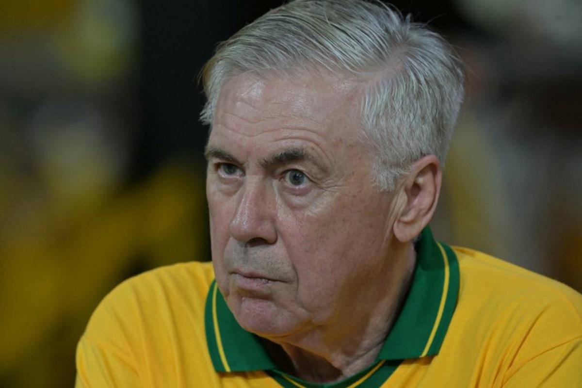 Brazil's Italian head coach Carlo Ancelotti gestures while attending the second night of carnival parade in the Sambadrome in Sao Paulo, Brazil, on February 14, 2026.  NELSON ALMEIDA / AFP