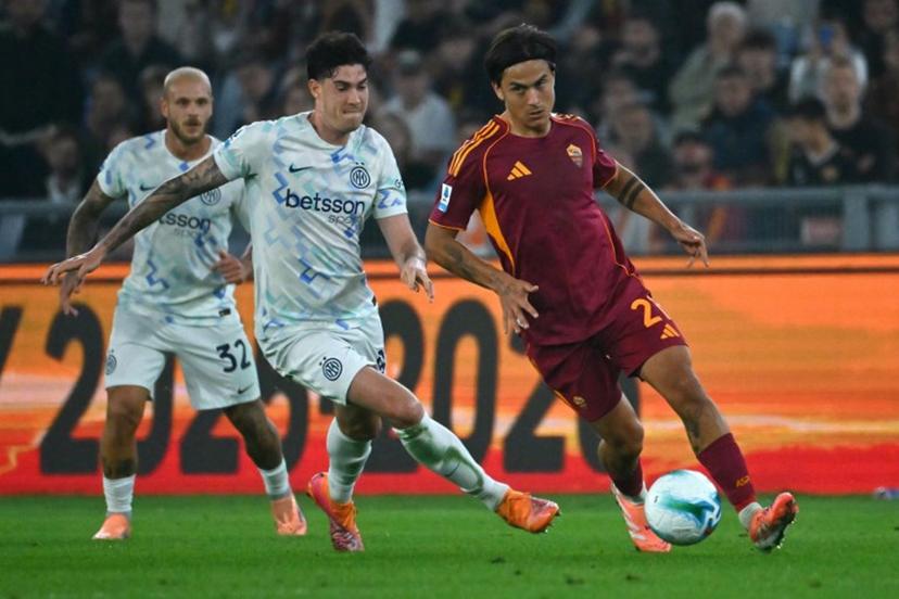 Roma's Argentine forward #21 Paulo Dybala fights for the ball with Inter Milan's Italian defender #95 Alessandro Bastoni during the Italian Serie A football match between AS Roma and Inter Milan at the Olympic Stadium in Rome on October 18, 2025.  Filippo MONTEFORTE / AFP