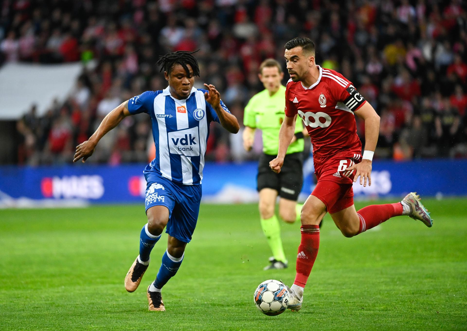 Gent's Gift Emmanuel Orban and Standard's Noe Dussenne fight for the ball during a soccer match between Standard de Liege and KAA Gent, Saturday 06 May 2023 in Liege, on day 2 (out of 6) of the Europe play-offs in the 'Jupiler Pro League' first division of the Belgian championship. BELGA PHOTO JOHN THYS