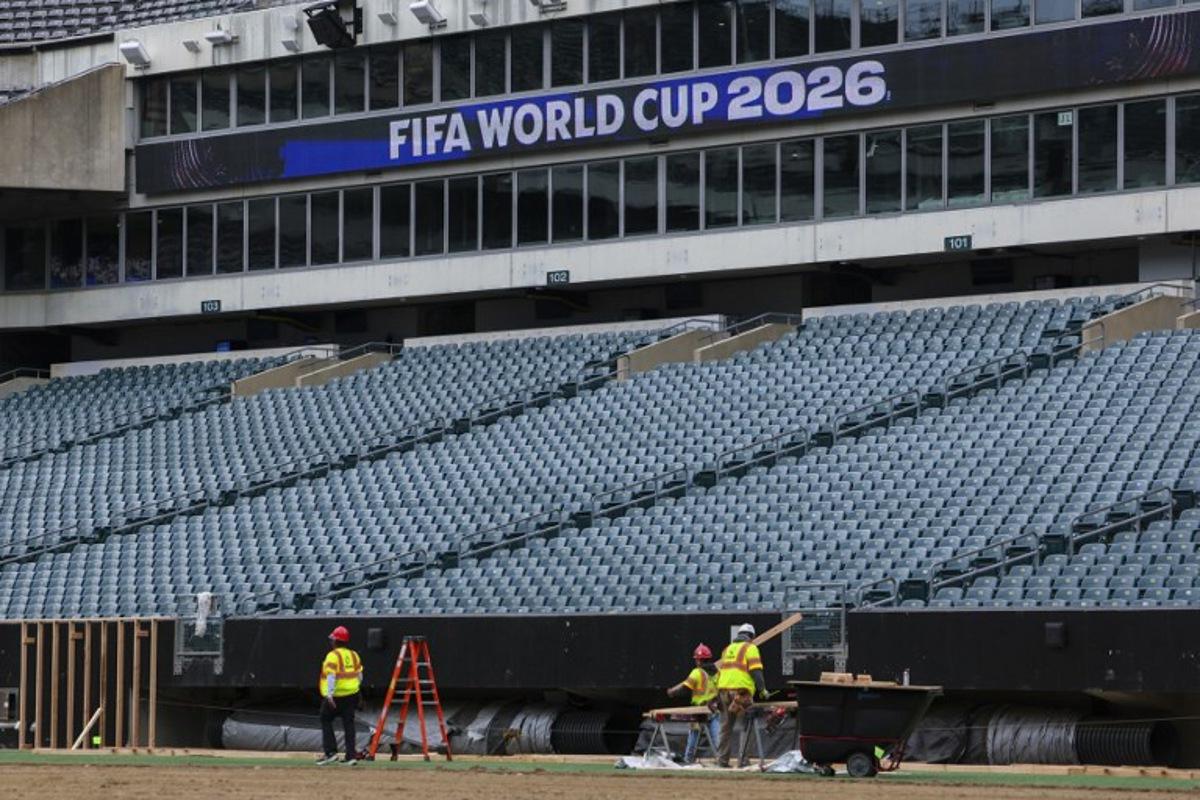 Workers prepare the field at Lincoln Financial Field, one of the stadiums hosting the 2026 FIFA World Cup at Lincoln Financial Field in Philadelphia, on April 28, 2026.  ANGELA WEISS / AFP