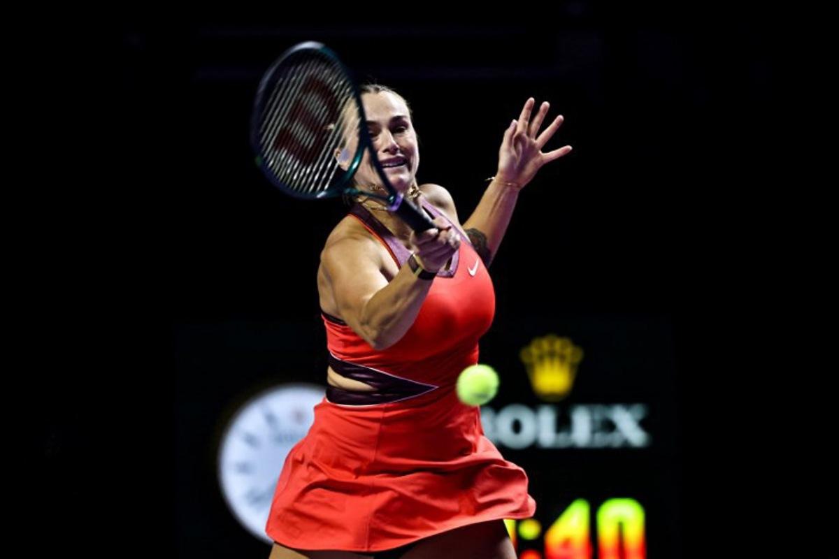 Belarus' Aryna Sabalenka hits a return against USA's Jessica Pegula during their tennis match at the WTA Finals in Riyadh on November 4, 2025.  Fayez NURELDINE / AFP