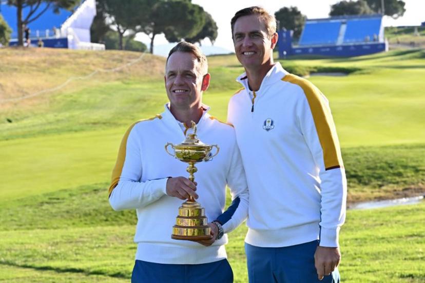 Europe's English captain, Luke Donald (L) and Europe's Belgian vice-captain, Nicolas Colsaerts (R) pose with the trophy during the European team official team portraits ahead of the 44th Ryder Cup at the Marco Simone Golf and Country Club in Rome on September 26, 2023.   Andreas SOLARO / AFP