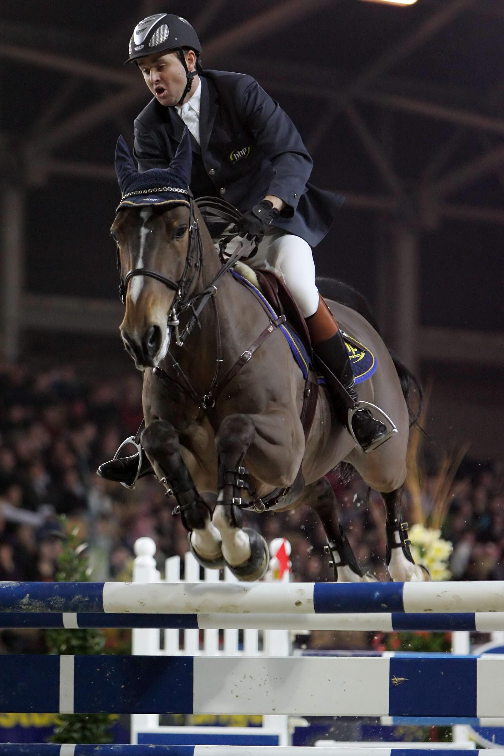 BRU126 - 20060226 - HASSELT, BELGIUM: Lieven Devos rides Peter van Spalbeek Z during the last day of the CSI Jumping of Hasselt, Sunday 26 Februray 2006. BELGA PHOTO YORICK JANSENS