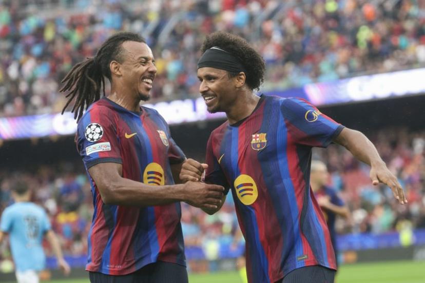 Barcelona's German forward #14 Karim Adeyemi (R) celebrates scoring his team's second goal with teammate Barcelona's French defender #23 Jules Kounde during the UEFA Champions League first round day 1 football match between FC Barcelona and Feyenoord at Camp Nou stadium in Barcelona on September 9, 2026.  Lluis GENE / AFP