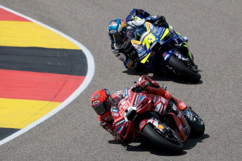 Ducati Lenovo Team's Spanish driver Marc Marquez (front) and BK8 Gresini Racing Team's Spanish driver Alex Marquez race during the German Motorcycle MotoGP Grand Prix at the Sachsenring race track in Hohenstein-Ernstthal near Chemnitz, eastern Germany, on July 12, 2026.  Ronny HARTMANN / AFP